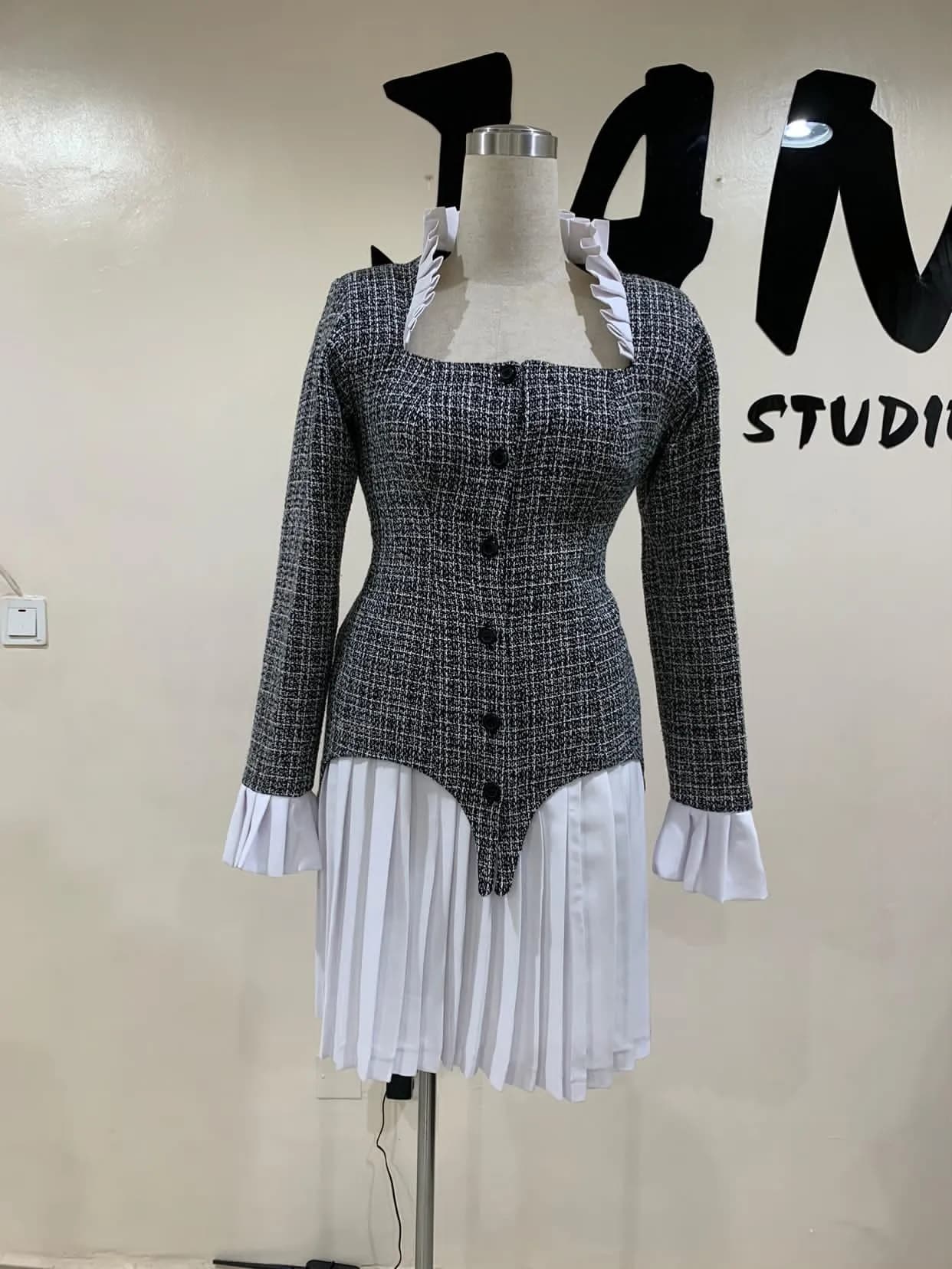A black and white corporate blazer and skirt.