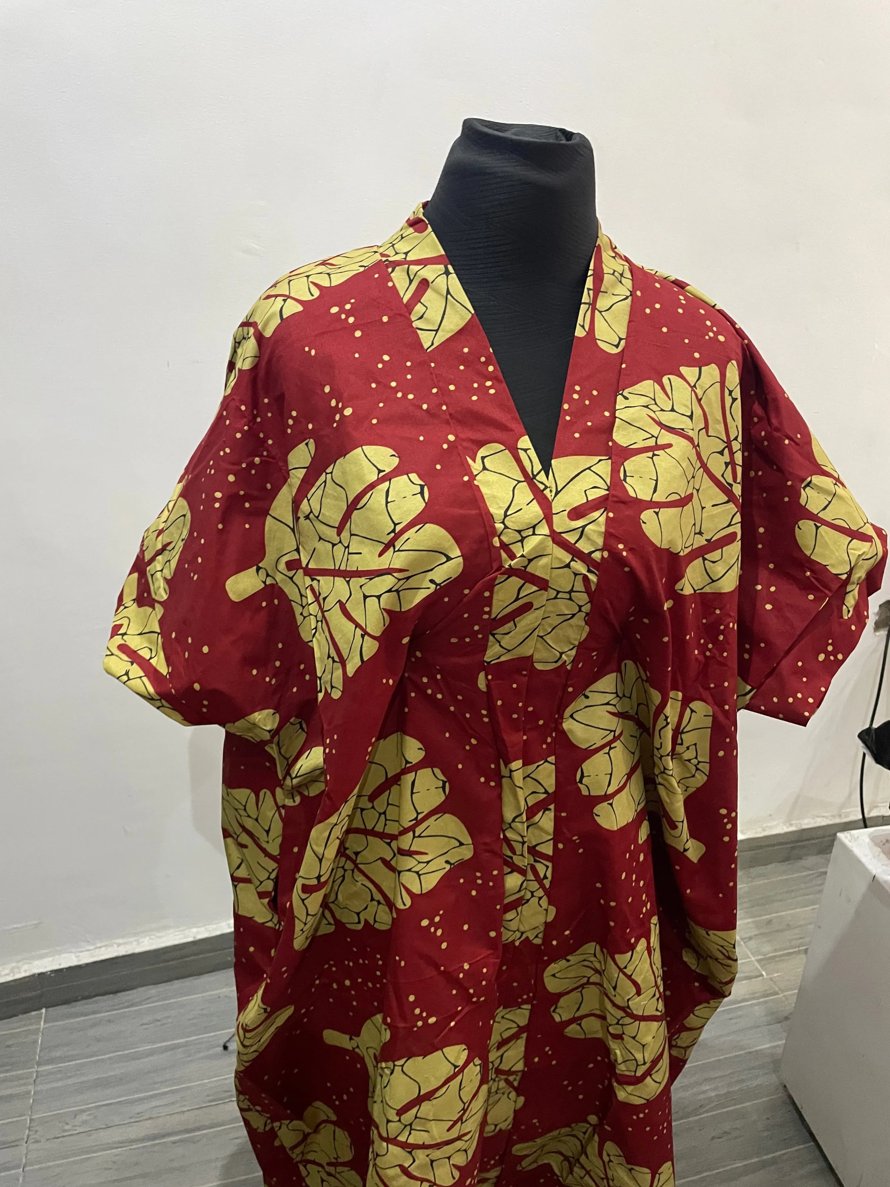 Red and dark yellow gown with leaf design 