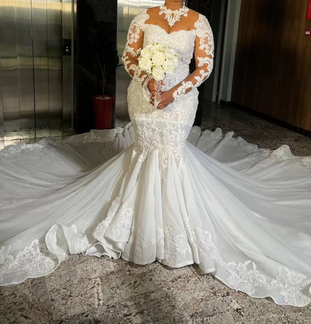 Wedding dress with full length veil and bouquet